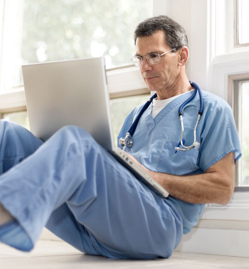 Doctor Using a Laptop